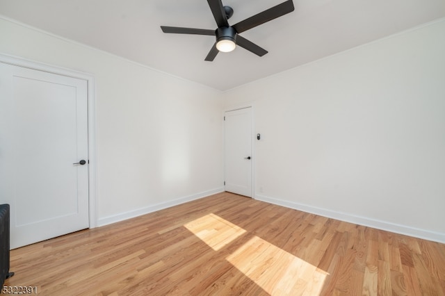 unfurnished room featuring light hardwood / wood-style floors and ceiling fan