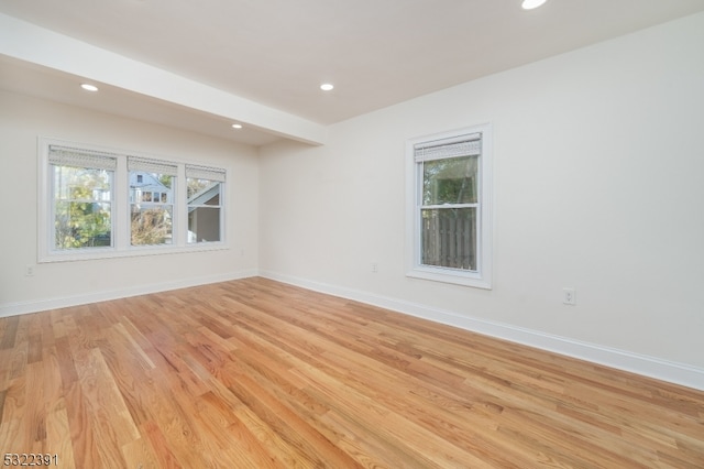 empty room with light hardwood / wood-style floors