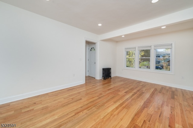 unfurnished living room with light wood-type flooring