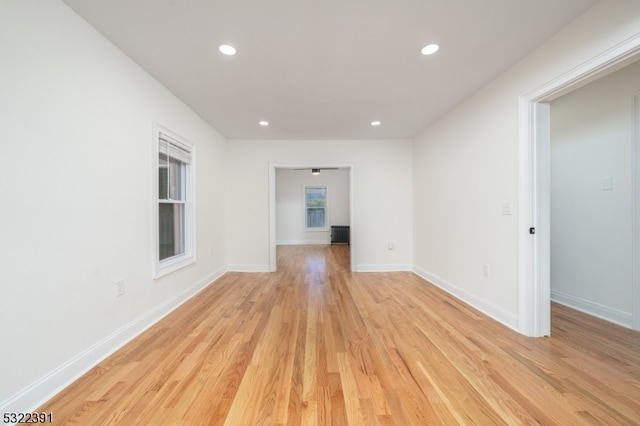 spare room featuring light wood-type flooring