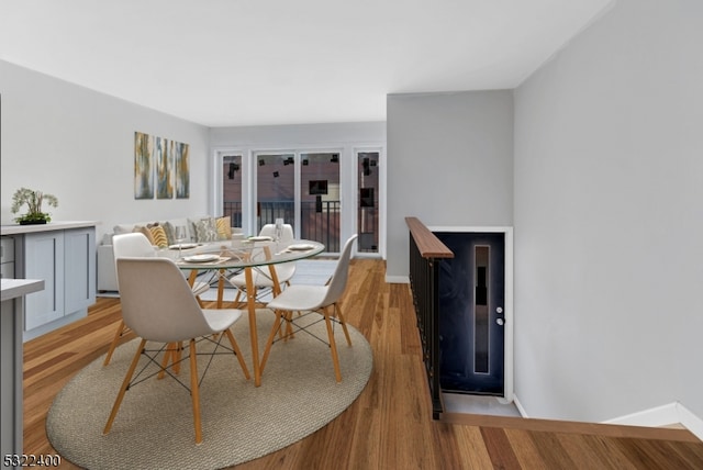 dining space featuring light wood-type flooring