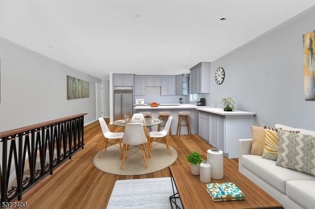 living room with light hardwood / wood-style floors