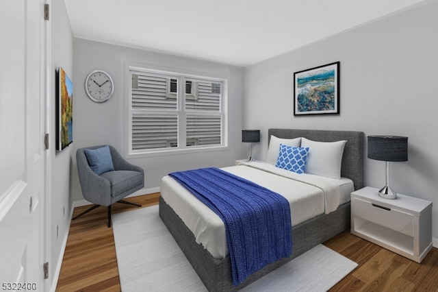 bedroom featuring dark hardwood / wood-style floors