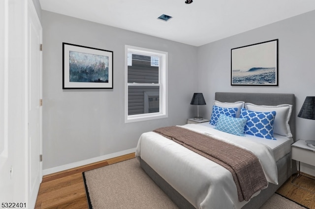 bedroom with light wood-type flooring