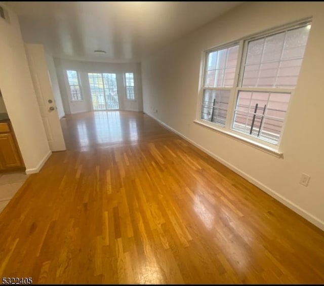 unfurnished room featuring light hardwood / wood-style flooring