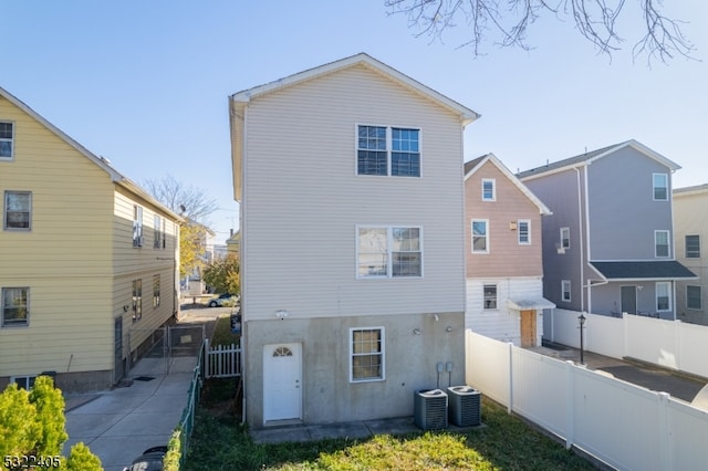 back of property with cooling unit