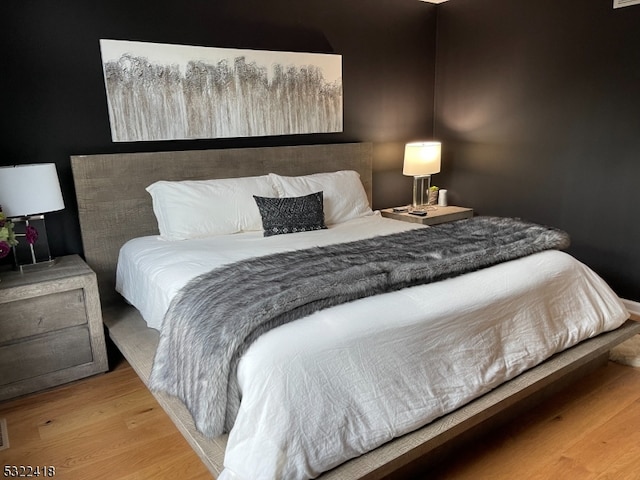 bedroom featuring wood-type flooring