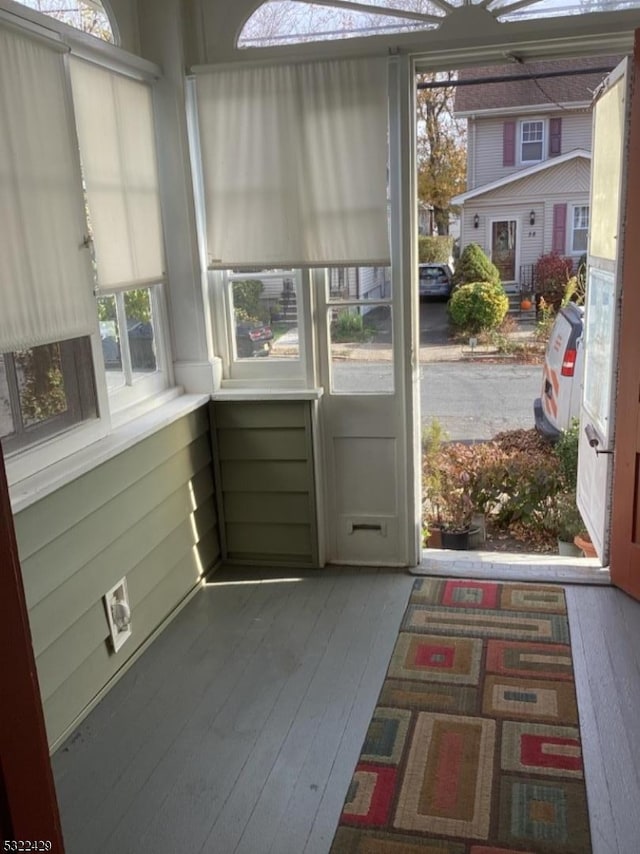 entryway with dark hardwood / wood-style flooring