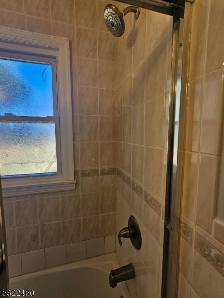 bathroom featuring enclosed tub / shower combo