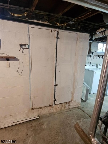 basement with washer and clothes dryer