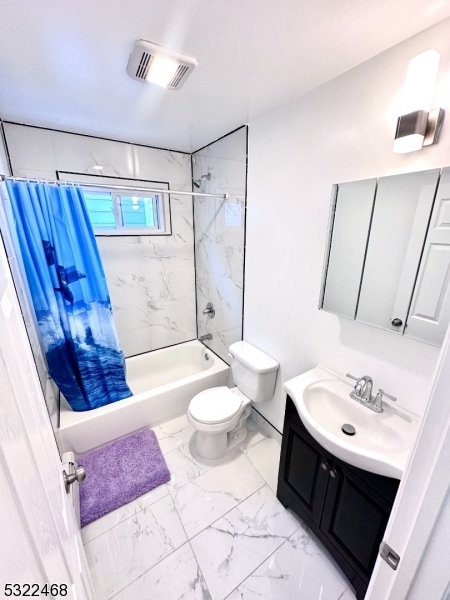 full bathroom featuring vanity, toilet, and shower / tub combo