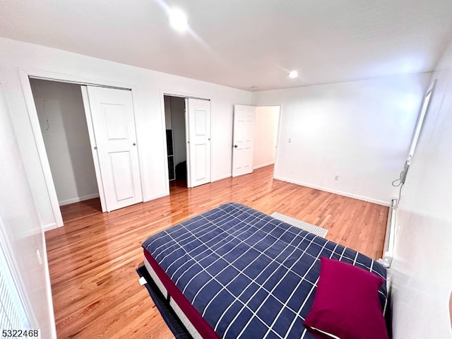 bedroom with hardwood / wood-style floors