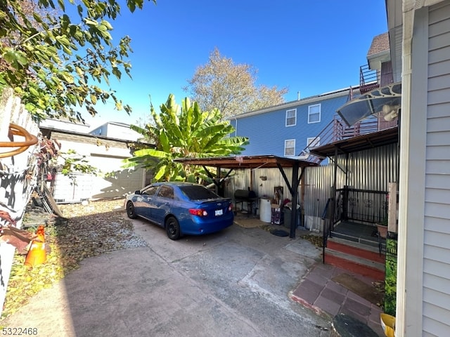 view of vehicle parking with a carport