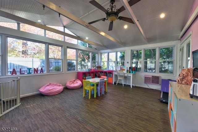 rec room with dark wood-type flooring, lofted ceiling with beams, and a healthy amount of sunlight