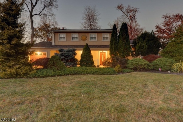 view of front of property with a lawn