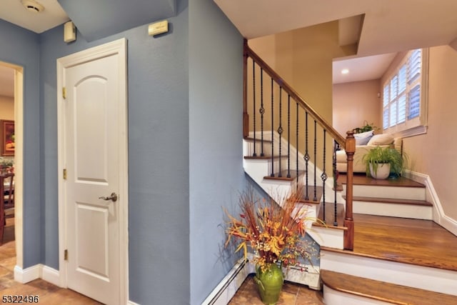 stairway featuring hardwood / wood-style flooring