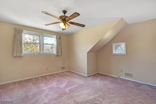 bonus room featuring carpet floors, a healthy amount of sunlight, baseboards, and visible vents