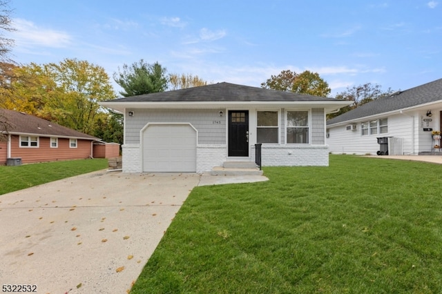 single story home featuring a front yard and a garage