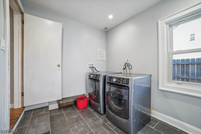 laundry area featuring washing machine and clothes dryer
