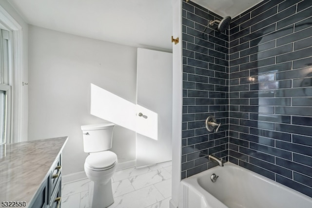 full bathroom featuring toilet, tiled shower / bath combo, and vanity