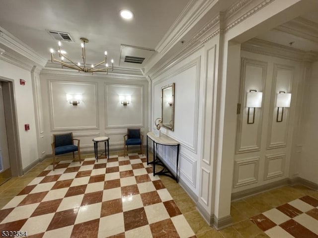 hall featuring a chandelier and ornamental molding