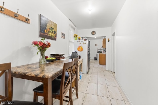 dining room featuring light tile patterned floors