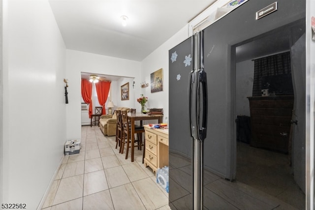 hall featuring light tile patterned floors