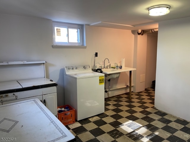 washroom with cabinets and washer / dryer