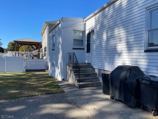 view of property exterior featuring a gazebo