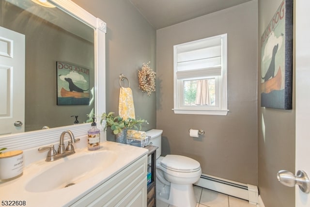 bathroom with tile patterned flooring, a baseboard radiator, vanity, and toilet