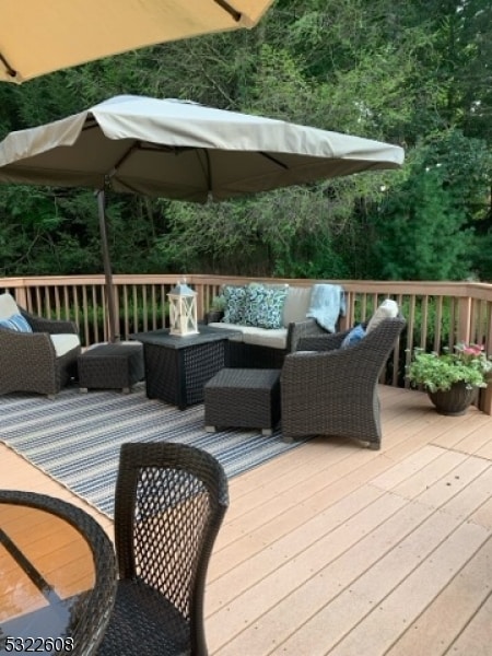 wooden deck with an outdoor living space