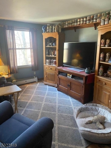 carpeted living room with a baseboard heating unit