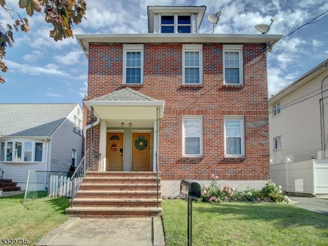 view of front of home with a front lawn