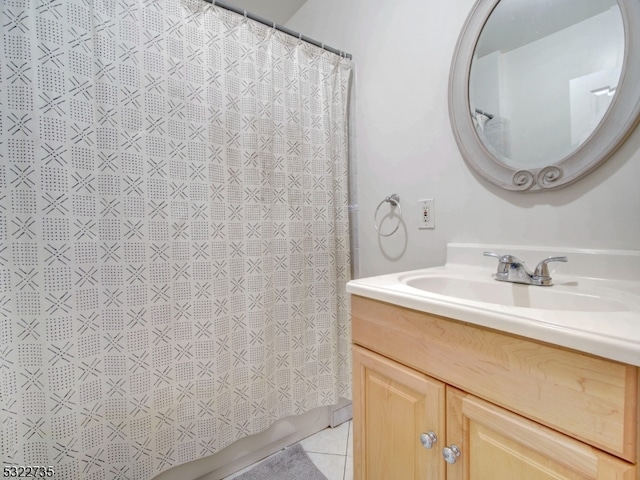 bathroom featuring tile patterned flooring and vanity