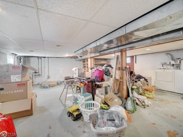 basement with washer and dryer and a drop ceiling