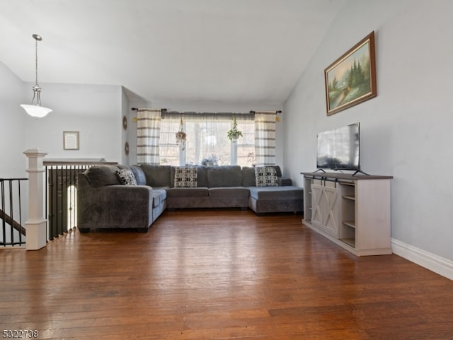 unfurnished living room with dark hardwood / wood-style flooring and lofted ceiling