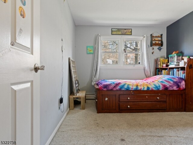 bedroom with light colored carpet