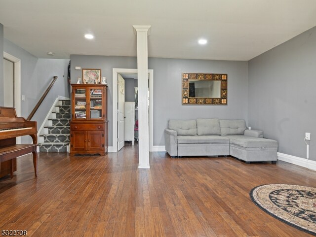 living room with dark hardwood / wood-style floors