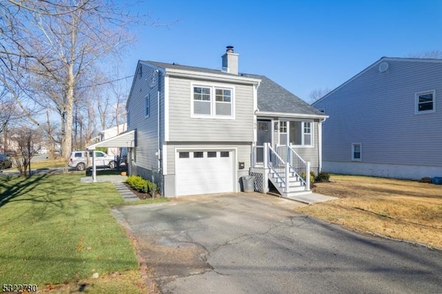 view of front of house with a front yard and a garage