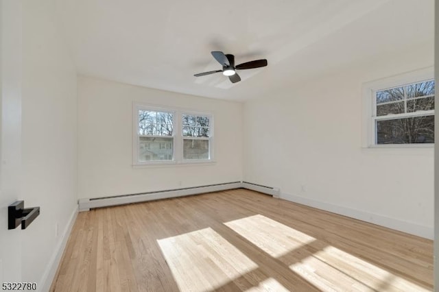 unfurnished room featuring ceiling fan, a baseboard radiator, and light hardwood / wood-style floors