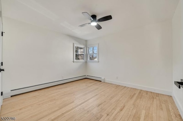 spare room with ceiling fan, light hardwood / wood-style floors, and a baseboard radiator