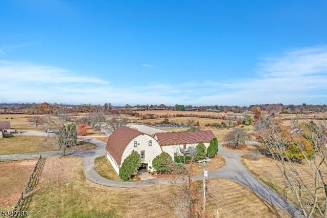 birds eye view of property featuring a rural view