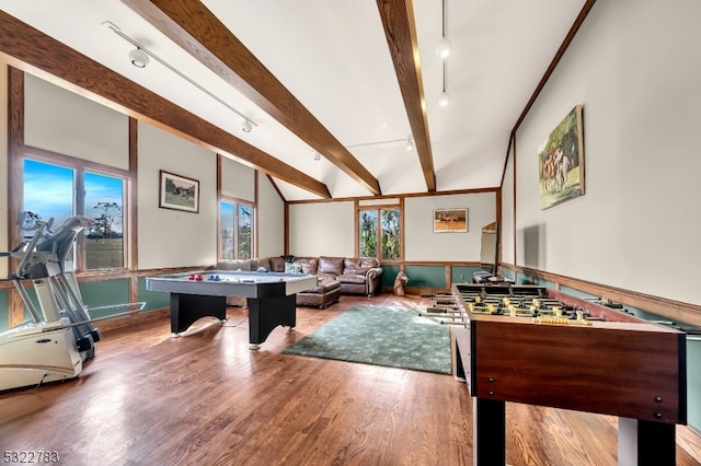 recreation room featuring rail lighting, hardwood / wood-style flooring, and beam ceiling