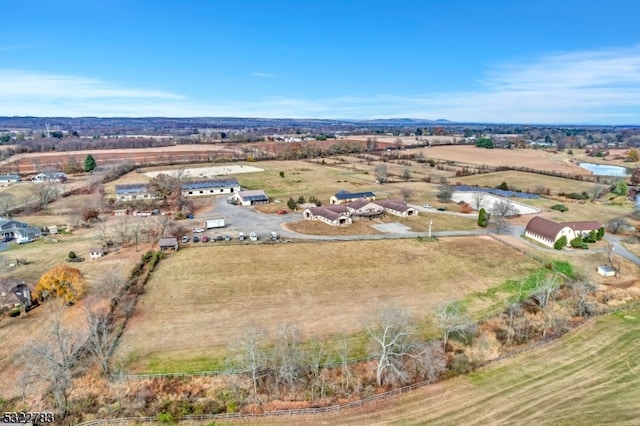 birds eye view of property with a rural view