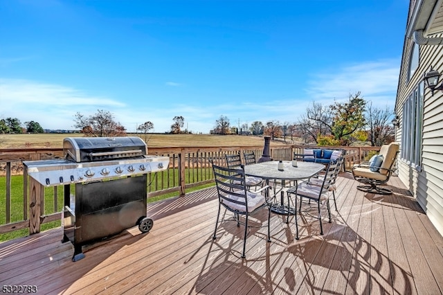 deck featuring area for grilling and a rural view