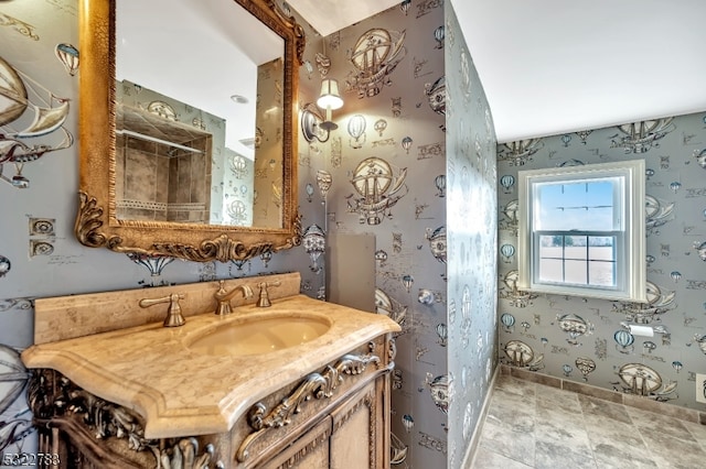 bathroom featuring tile patterned flooring and vanity