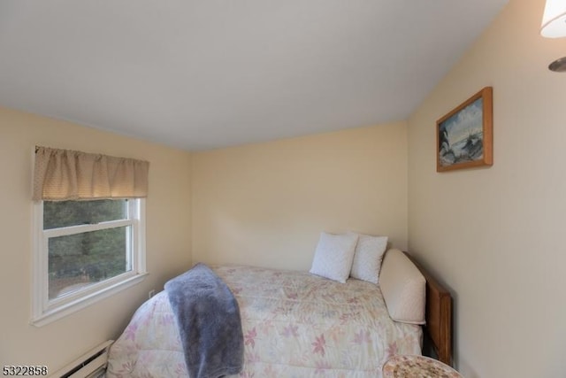 bedroom featuring a baseboard heating unit