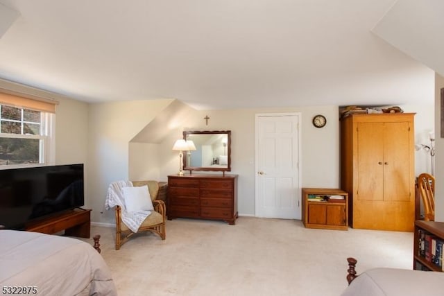 bedroom featuring light carpet