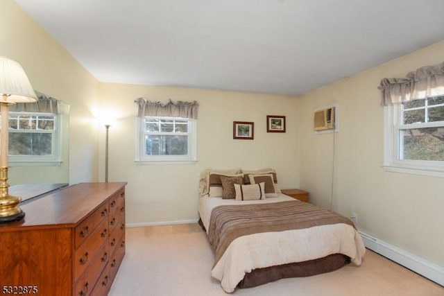 bedroom featuring a baseboard radiator, multiple windows, baseboards, and light colored carpet