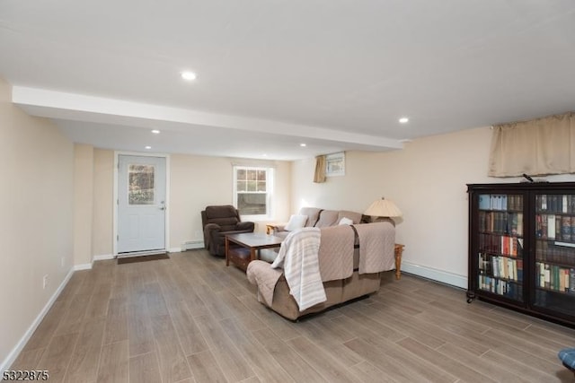 living area with light wood-style floors, recessed lighting, and baseboards